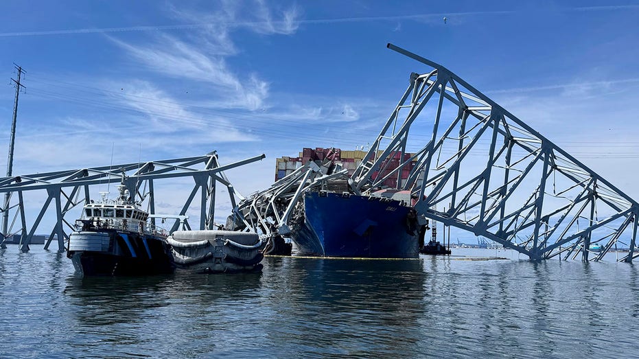 Baltimore bridge collapse: Crews cut, lift away 200-ton chunk of tangled structure, channel opened
