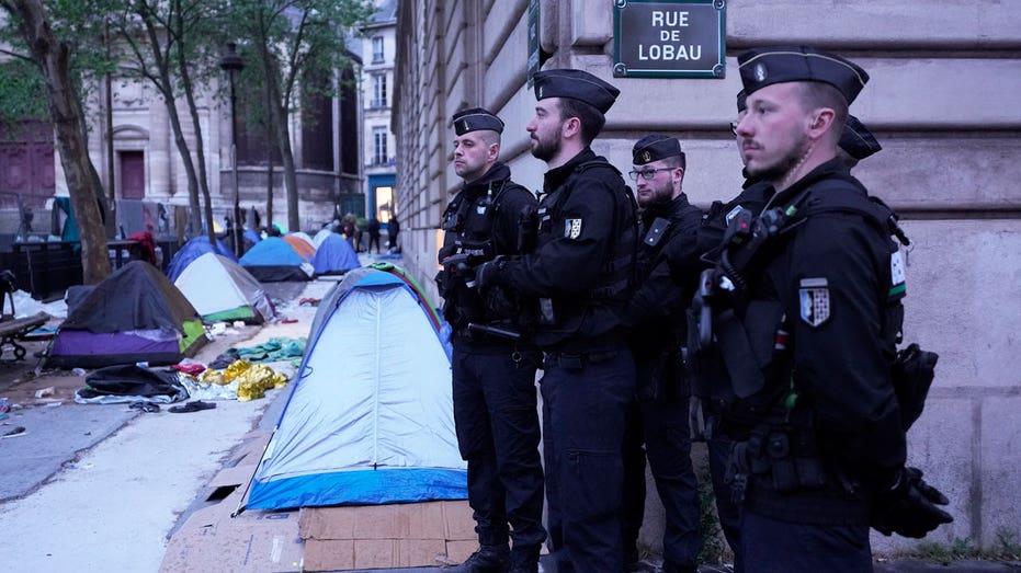 As Olympics near, Paris police clear 100 migrants from camp near City Hall