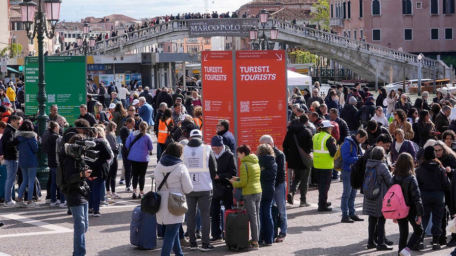 Venice begins charging entry fee for day-trippers to address tourism crisis