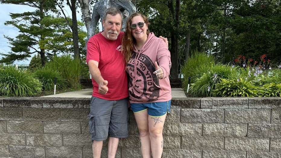 Robert and Tiffany Younk standing together