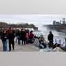 Crowds gather to watch the eclipse in Niagara Falls, New York