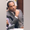 Former American football star and actor O.J. Simpson listens to testimony during his double murder trial in Los Angeles