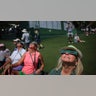 Viewers use special protective glasses to observe a total solar eclipse during a practice round at The Masters Golf Tournament