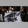 People assemble to view a partial solar eclipse,at Times Square in New York City