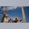 Women view the solar eclipse outside the National Monument