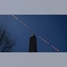 This composite image of multiple exposures shows the progression of a partial solar eclipse over the Washington Monument