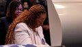 Chantemekki Fortson, left, the mother of slain airman Roger Fortson stands at his casket during his funeral at New Birth Missionary Baptist Church, Friday, May 17, 2024, near Atlanta.