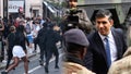 British Prime Minister Rishi Sunak surrounded by the Army in split with Youths.