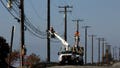 Utility crews repair overhead lines along Pacific Coast Highway just west of Malibu, Calif., on Nov. 25, 2018. On Thursday, May 9, 2024, the California Public Utilities Commission will consider a change in how the state's investor-owned utilities calculate their customers' power bills.
