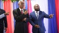 Edgard Leblanc Fils, left, and Smith Augustin prepare to pose for a group photo with the transitional council after it named Fils as its president in Port-au-Prince, Haiti, Tuesday, April 30, 2024. The transitional council will act as the country&rsquo;s presidency until it can arrange presidential elections sometime before it disbands, which must be by February 2026.