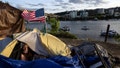 Frank, a homeless man sits in his tent with a river view in Portland, Ore., Saturday, June 5, 2021. The city council in Portland, Oregon, has approved new homeless camping rules. Under the rules, people who reject offers of shelter can face penalties, including fines of up to $100 or up to seven days in jail. - Fox News