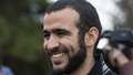 Omar Khadr smiles as he answers questions during a news conference after being released on bail in Edmonton, Alberta, May 7, 2015. Khadr, a Canadian, was once the youngest prisoner held on terror charges at Guantanamo Bay.