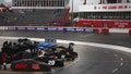 A general view of cars covered and parked on the grid during a weather delay in qualifying for the NASCAR Cup Series All-Star Open at North Wilkesboro Speedway on May 17, 2024 in North Wilkesboro, North Carolina.