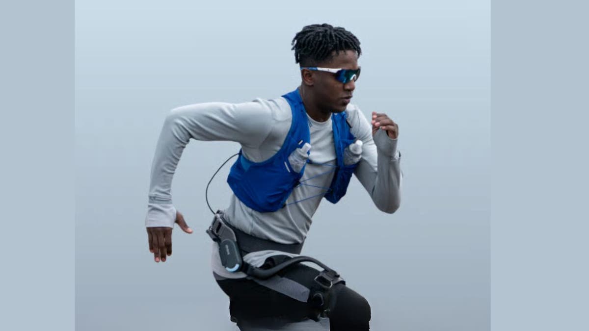 Man running wearing an exoskeleton