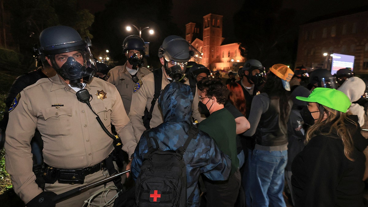 Law enforcement officers confronting protesters