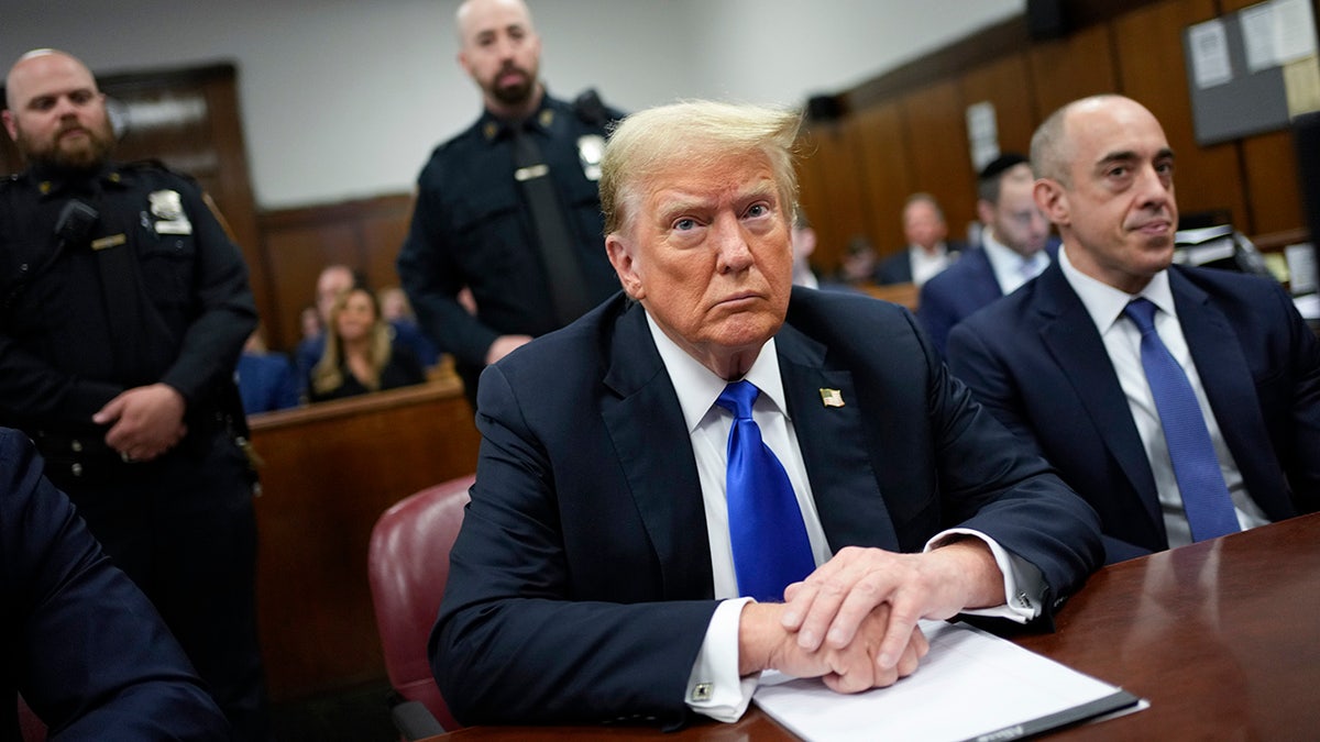 Donald Trump at defense table in courtroom
