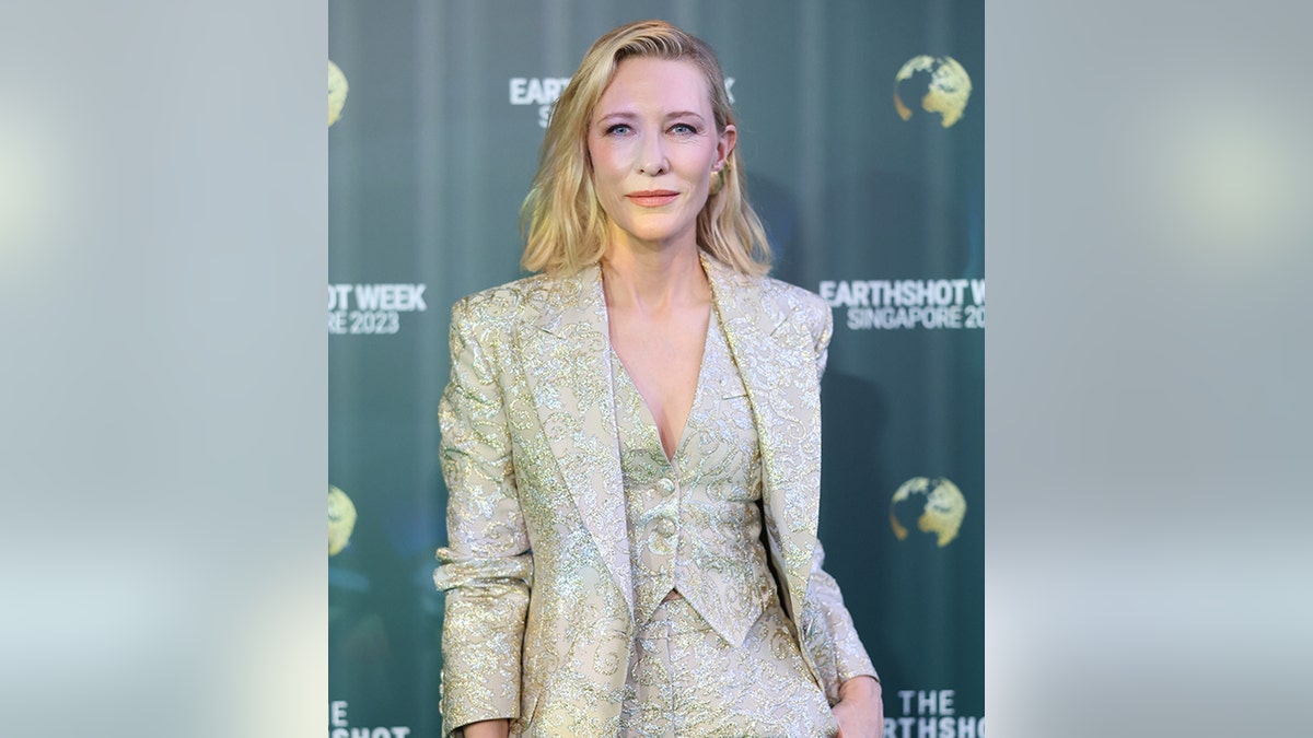 Cate Blanchett in a monochromatic suit jacket and vest and pants