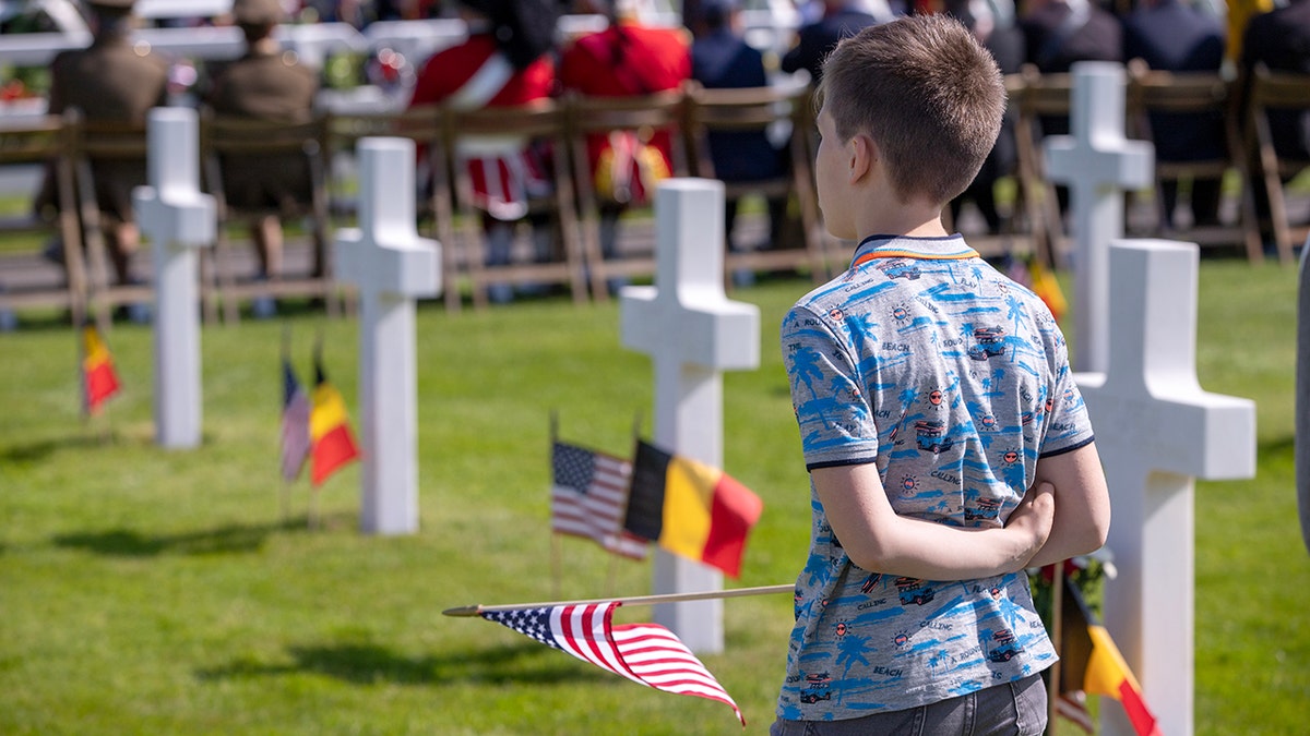 Boy at military cemetery