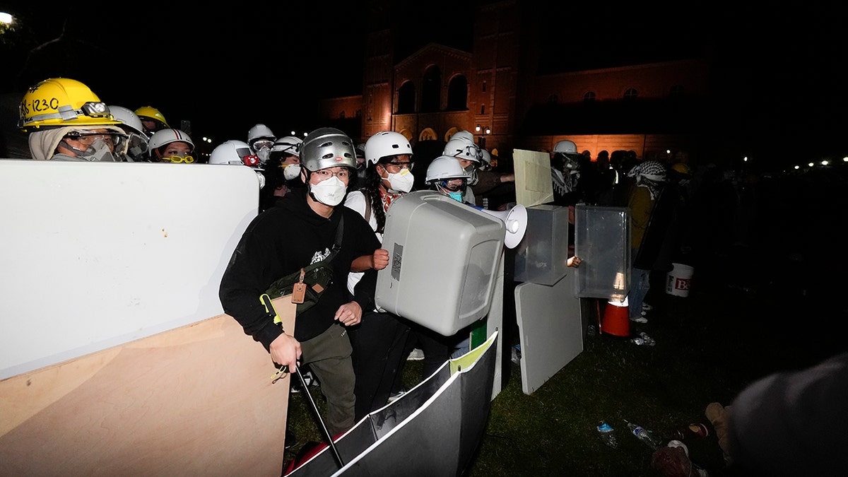 Protesters behind a barricade