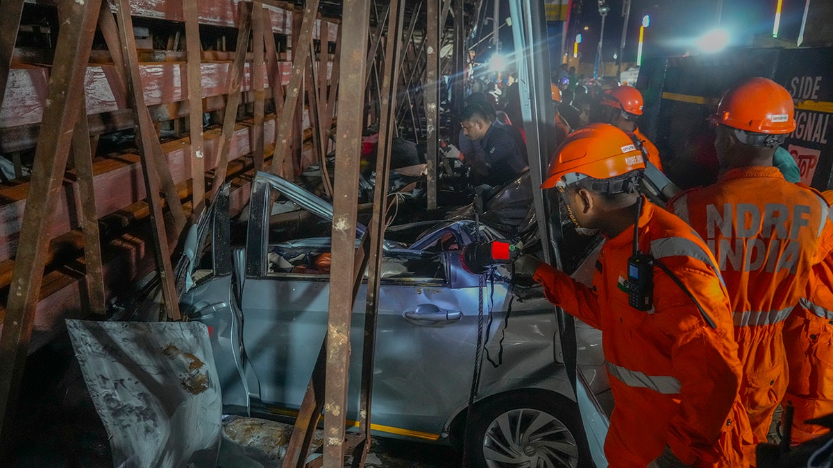 Rescuers in orange gear