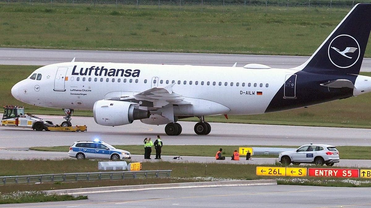 Climate activists glue themselves to runway at Munich airport in Germany Munich Germany Bavaria Airport Climate Activists Protest Glue Runway