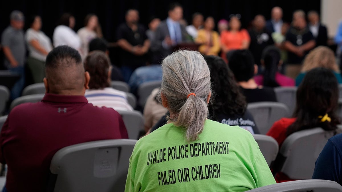 Women wears a t-shirt saying Uvalde police failed our children