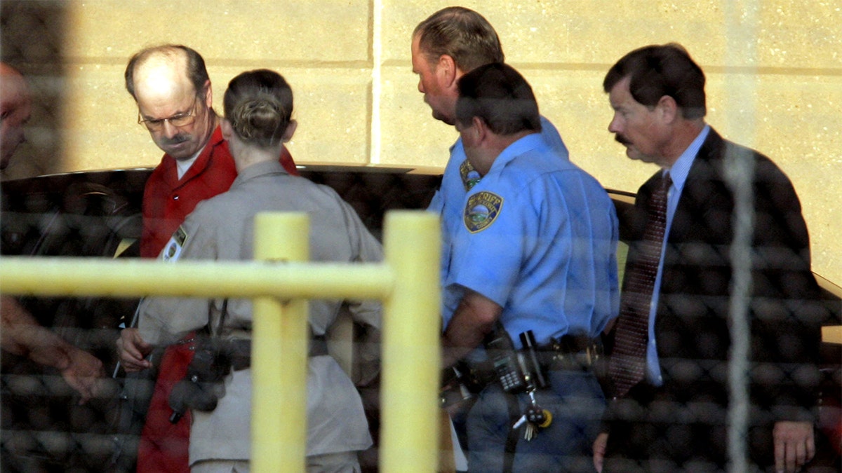 Photo of the BTS killer entering the El Dorado Correctional Facility.