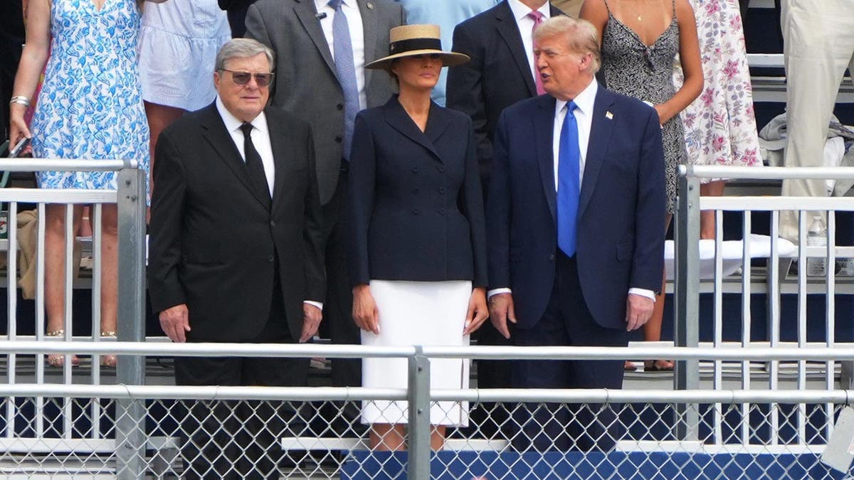 Donald Trump, Melania Trump and Viktor Knavs in the stands
