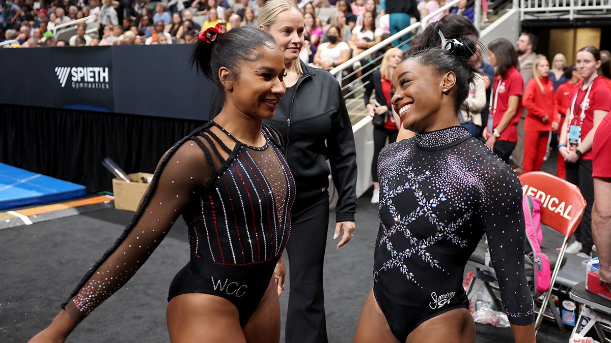 Jordan Chiles and Simones Biles greet one another