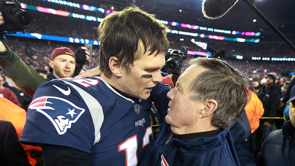Tom Brady celebrates with Bill Belichick