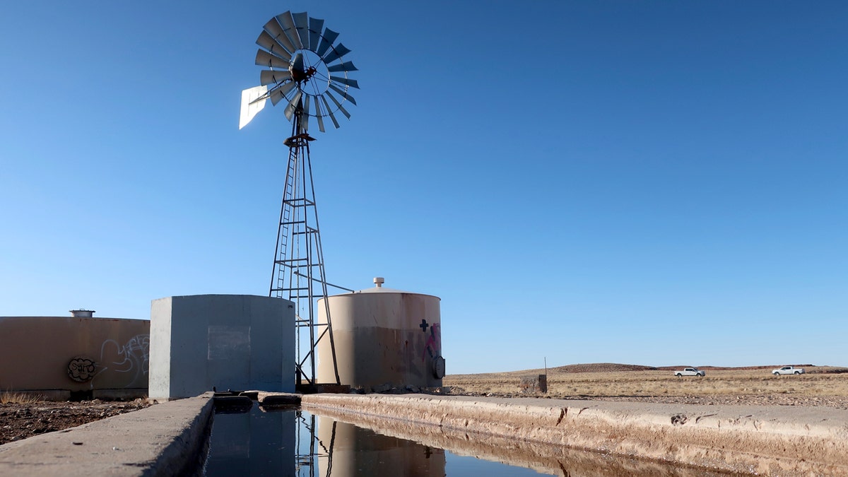 A windmill draws water for livestock in Leupp, Arizona, on the Navajo Nation.