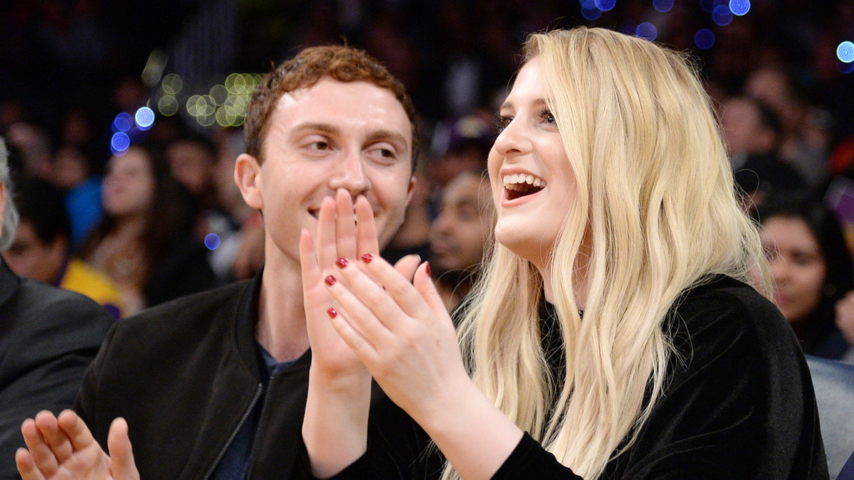 Daryl Sabara and Meghan Trainor at a sports game