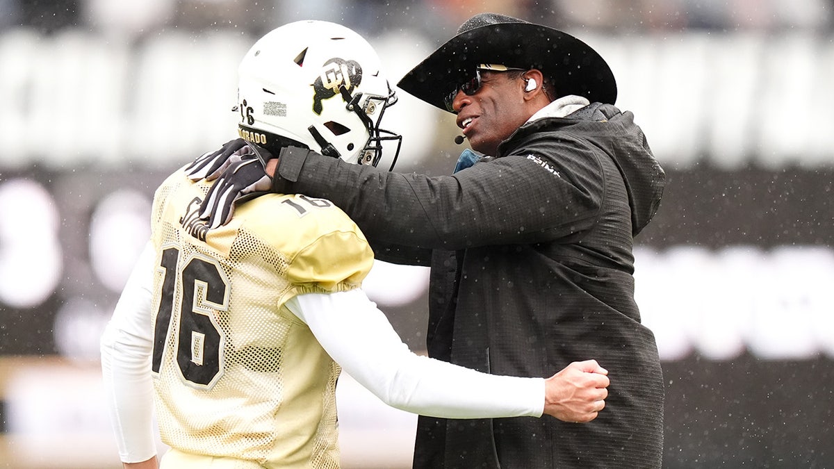 Ryan Staub with Deion Sanders