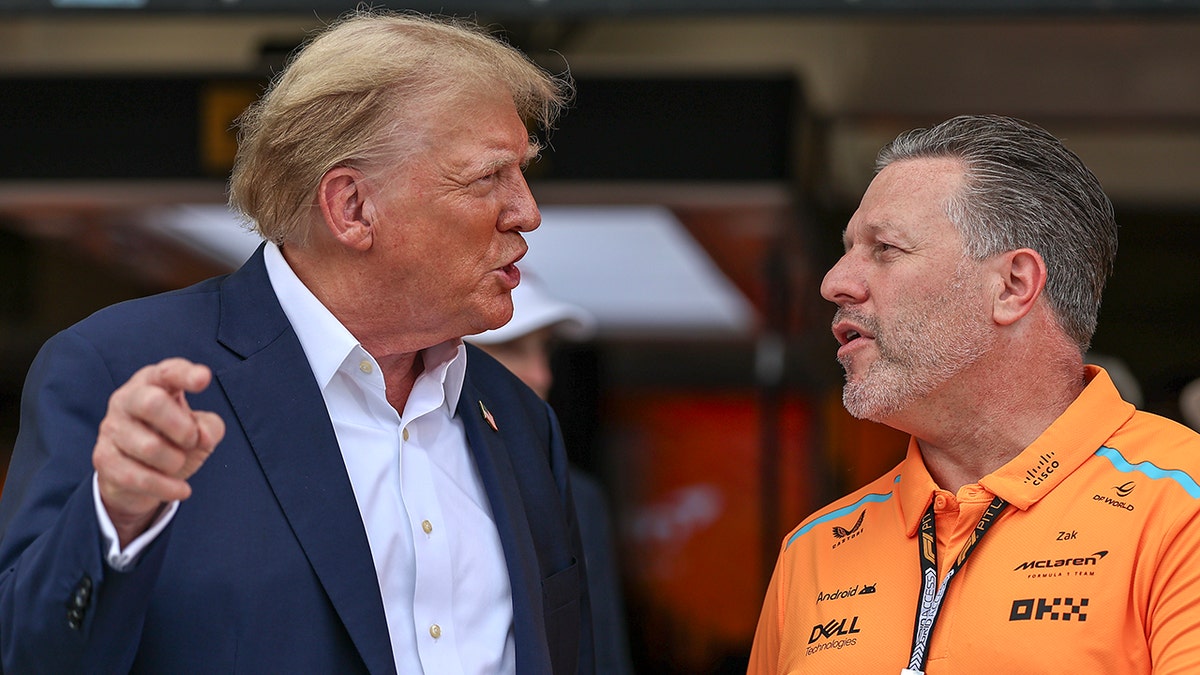 Donald Trump speaks to USA's Jack Brown and the McLaren F1 team