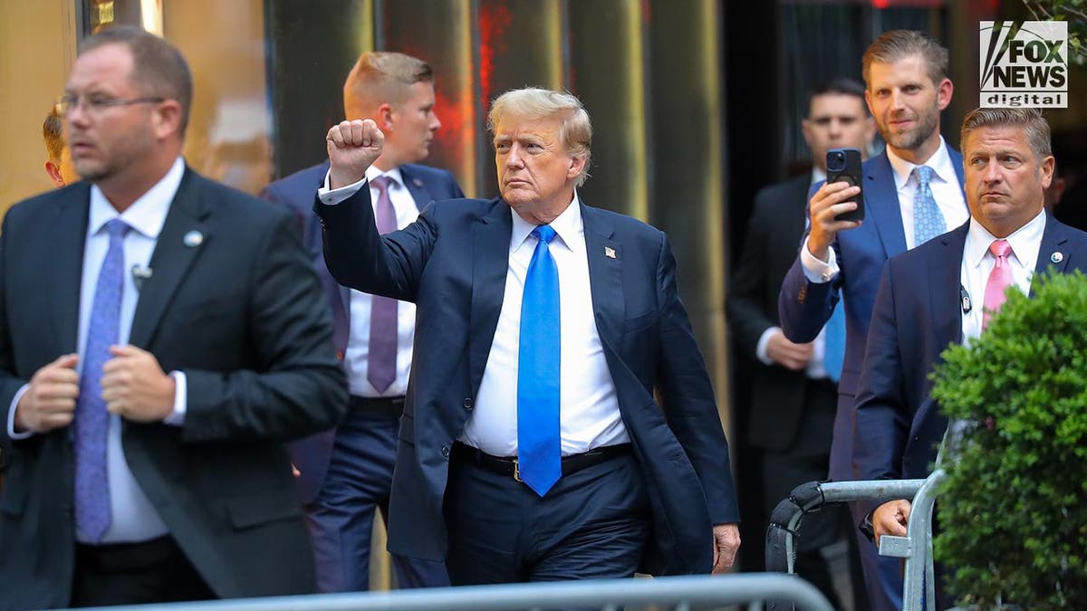 Donald Trump arriving astatine  Trump Tower pumping fist