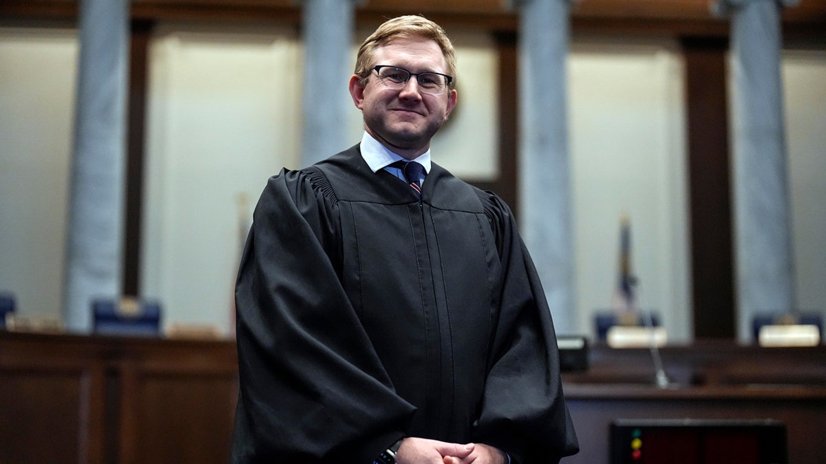 Supreme Court Justice Andrew Pinson poses