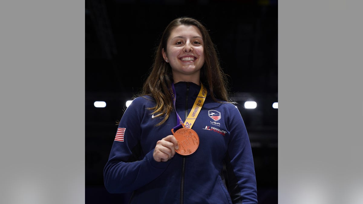 Elizabeth Tartakovsky poses with a medal