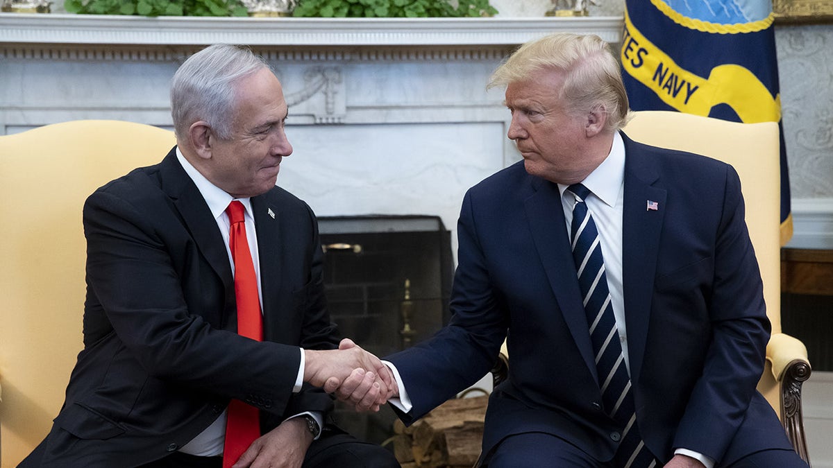 Trump shakes Netanyahu's hand in the Oval Office
