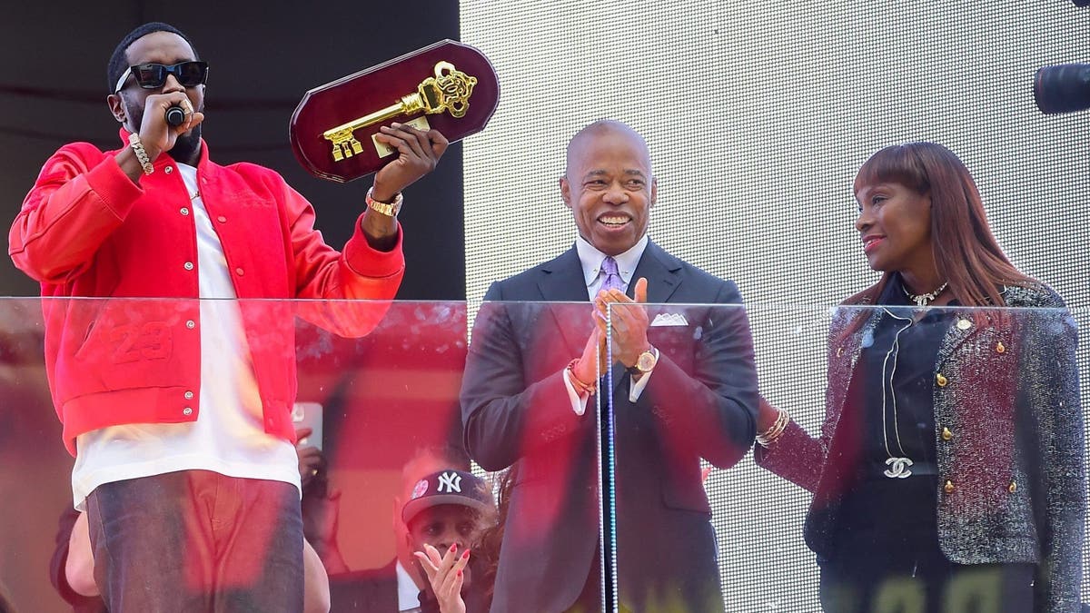 Sean "Diddy" Combs (L) is seen receiving the Key to the City from Mayor Eric Adams