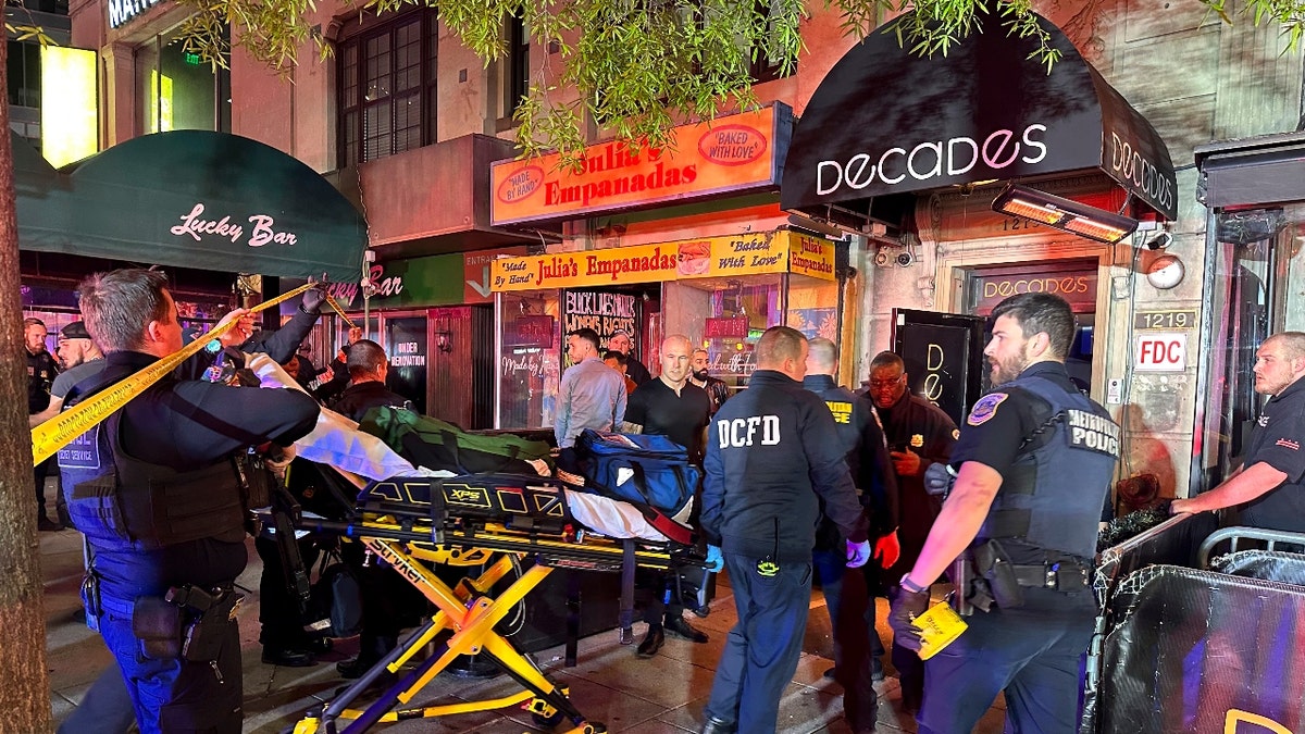 First responders arrive with a stretcher at the scene of a shooting at the Decades nightclub on Friday, April 26, 2024 in Washington, DC.