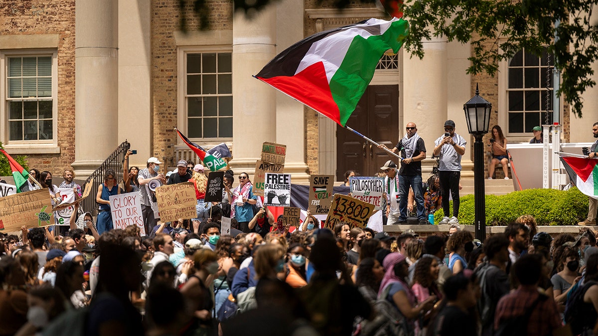Protesters with a Palestinian flag