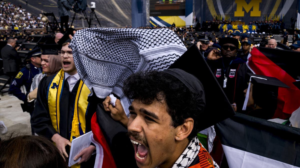 ANN ARBOR, MICHIGAN - MAY 4: Joseph Fisher chants during a Pro-Palestinian protest during the University of Michigan's spring commencement ceremony on May 4, 2024 at Michigan Stadium in Ann Arbor, Michigan. (Photo by Nic Antaya/Getty Images)