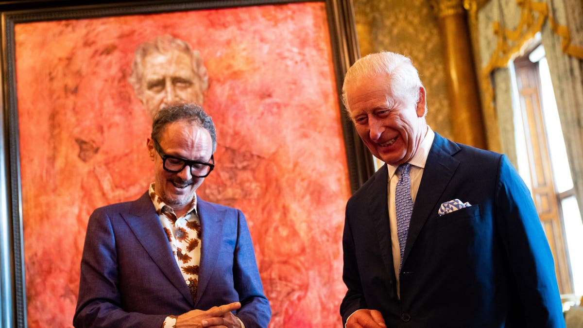king charles and jonathan yeo smiling in front of portrait