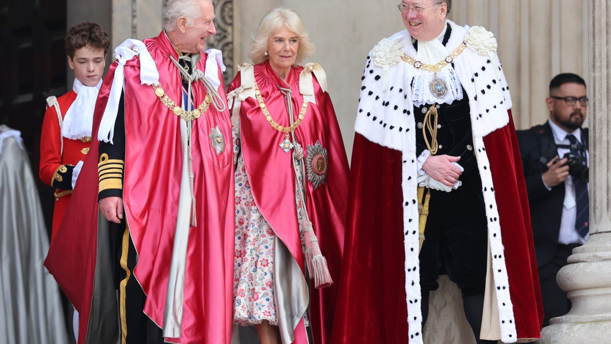 King Charles III shares a joke with Lord Mayor, Alderman Professor Michael Mainelli as he and Queen Camilla depart a service of dedication for the Order of The British Empire