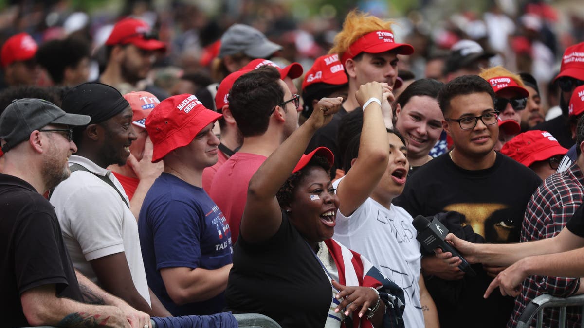 Trump supporters cheer at a rally in the Bronx, NY