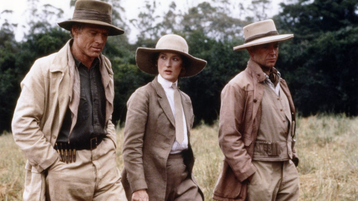 Robert Redford, Meryl Streep and Austrian actor klaus-Maria Brandauer on the set of out of africa