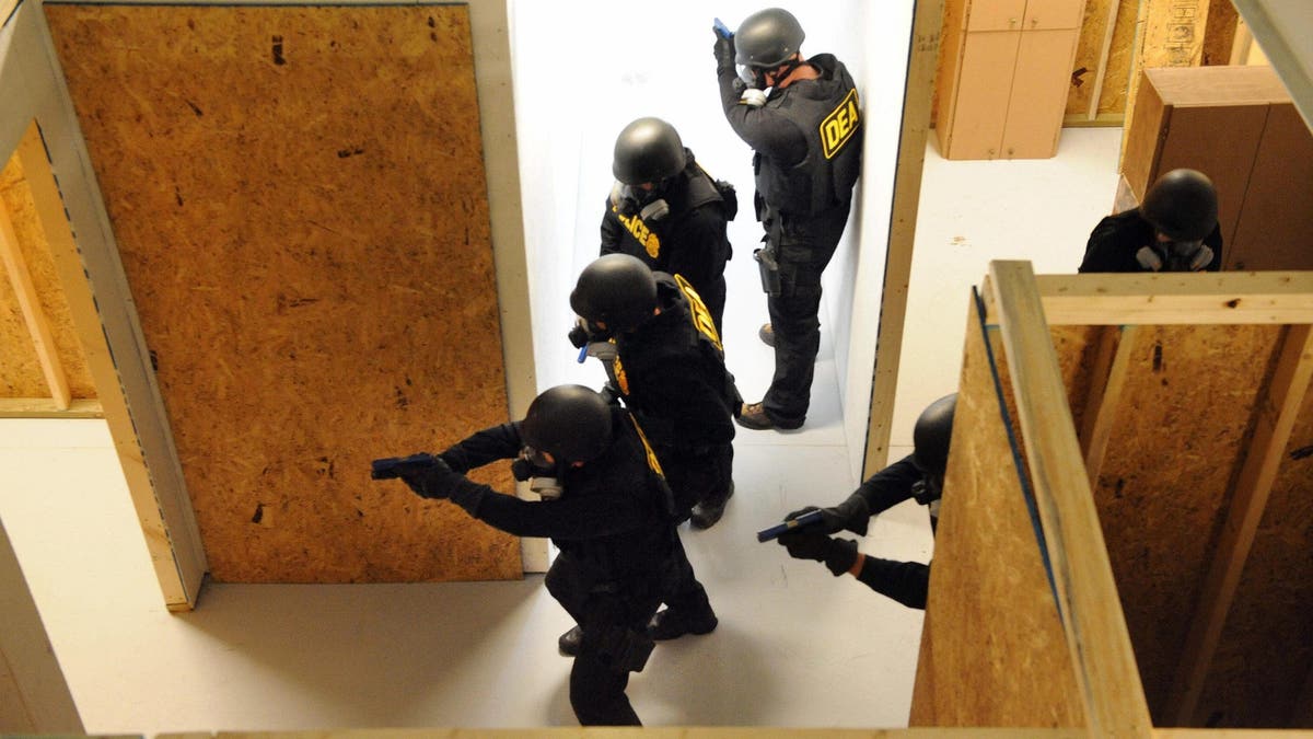 US Drug Enforcement Administration (DEA) agents train in tactical gear at Quantico
