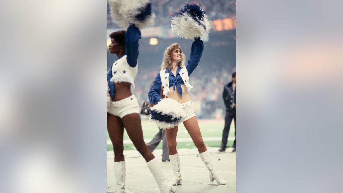 A throwback photo of the Dallas Cowboys Cheerleaders on the field