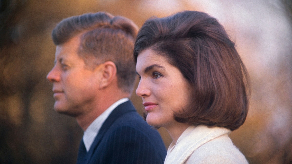 A side profile photo of John F. Kennedy and Jackie Kennedy