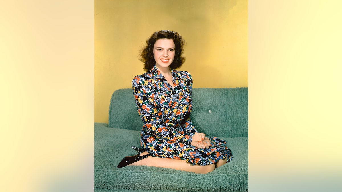 Judy Garland wearing a floral dress